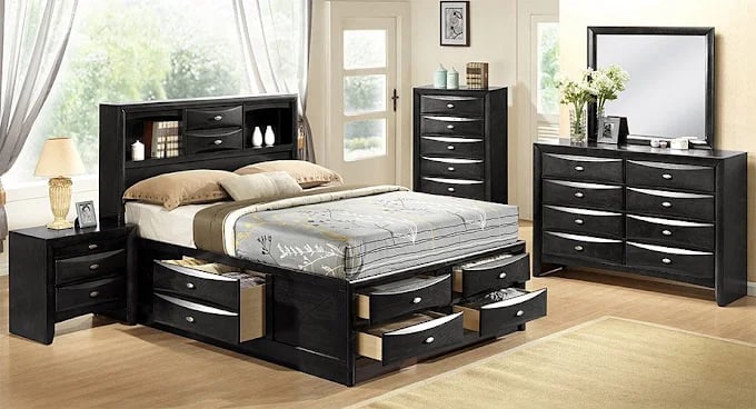 Black bedroom set with storage bed, dresser, and nightstands
